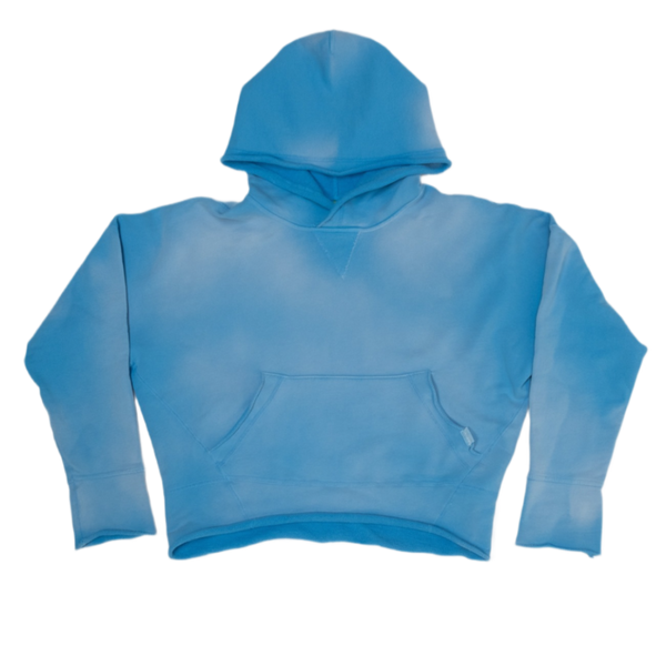 A cropped long-sleeve hoodie in a vintage washed medium blue color,