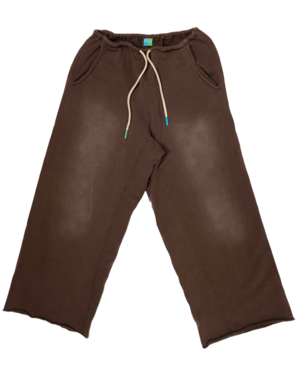 A pair of dark brown wide-leg sweatpants with a cream-colored drawstring and side pockets, laid flat against a white background.