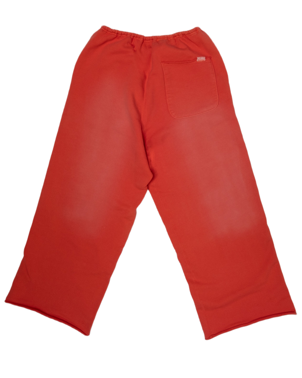 red sweatpant with single backpocket.