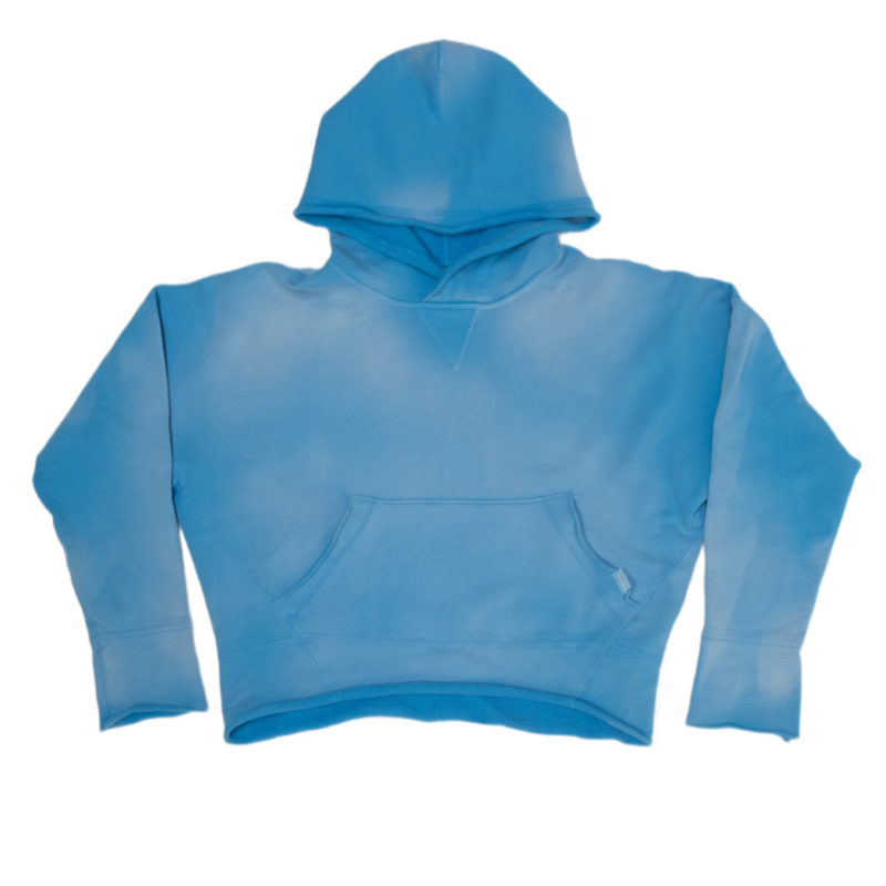 A cropped long-sleeve hoodie in a vintage washed medium blue color, 