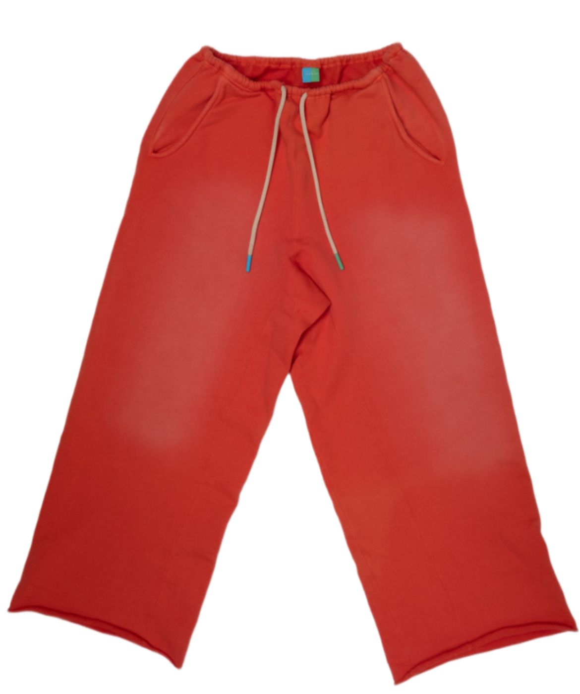Red sweatpants with a drawstring waist and side pockets, laid flat on a white background.