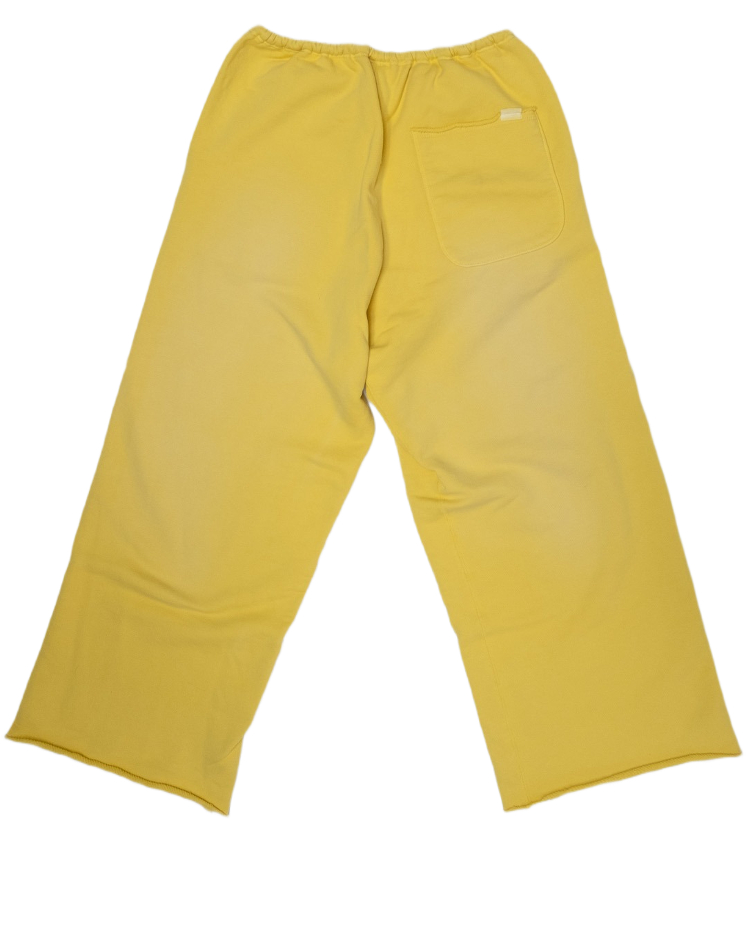 A pair of yellow wide-leg trouser sweatpants shown from the back, featuring an elastic waistband, a back pocket, and a small white brand tag, laid flat on a white background.